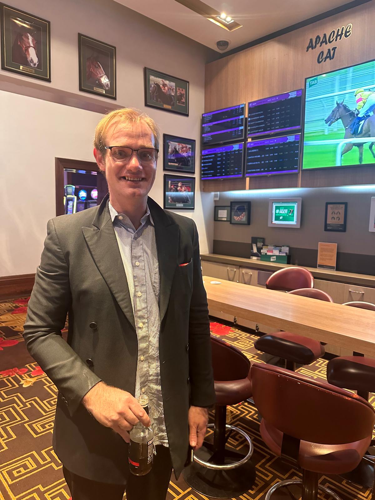 Participant smiling at a community venue